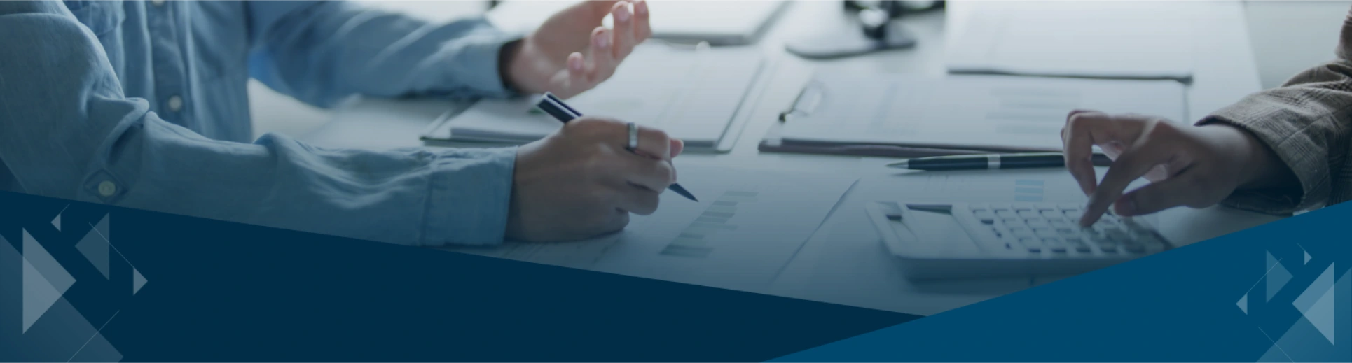 CPA business advisor reviewing financial reports with business owners